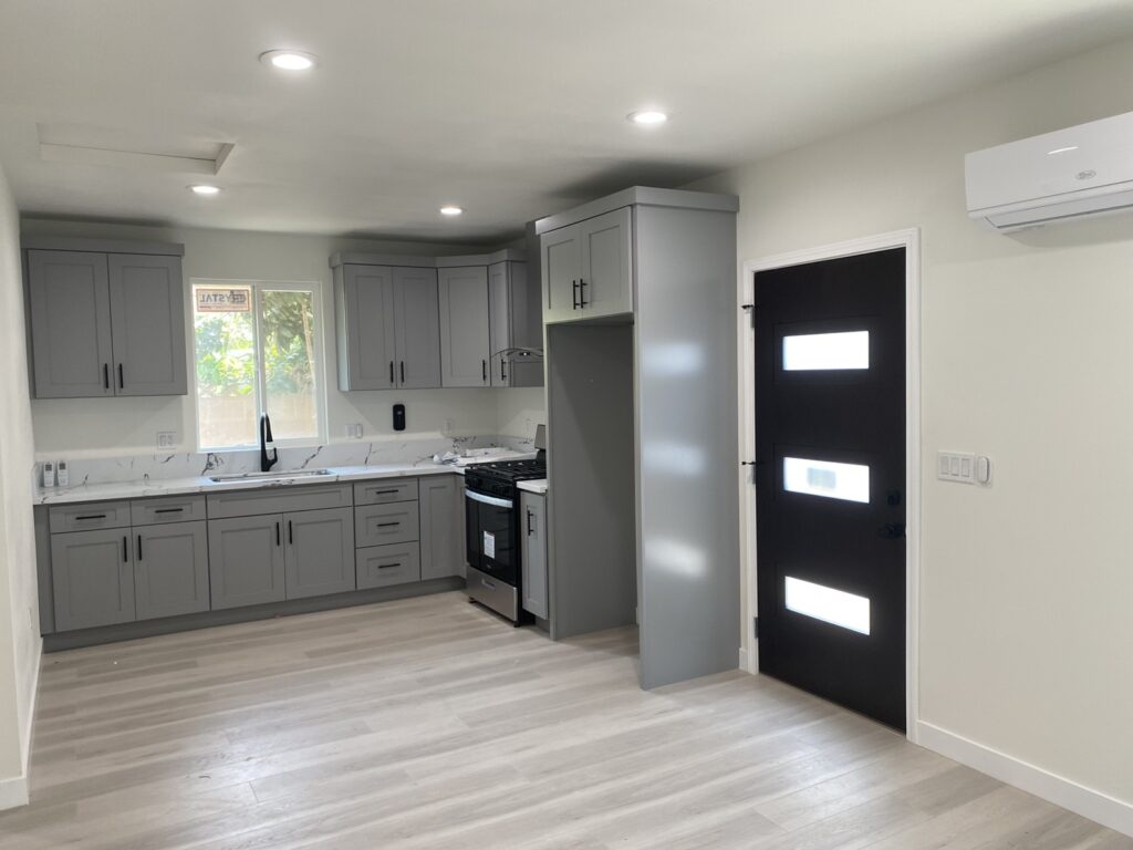 ADU kitchen and living area with gray cabinets