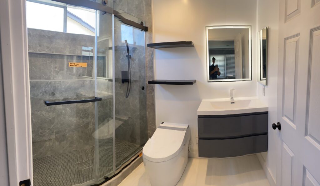 Bathroom remodel with glass walk-in shower and floating vanity