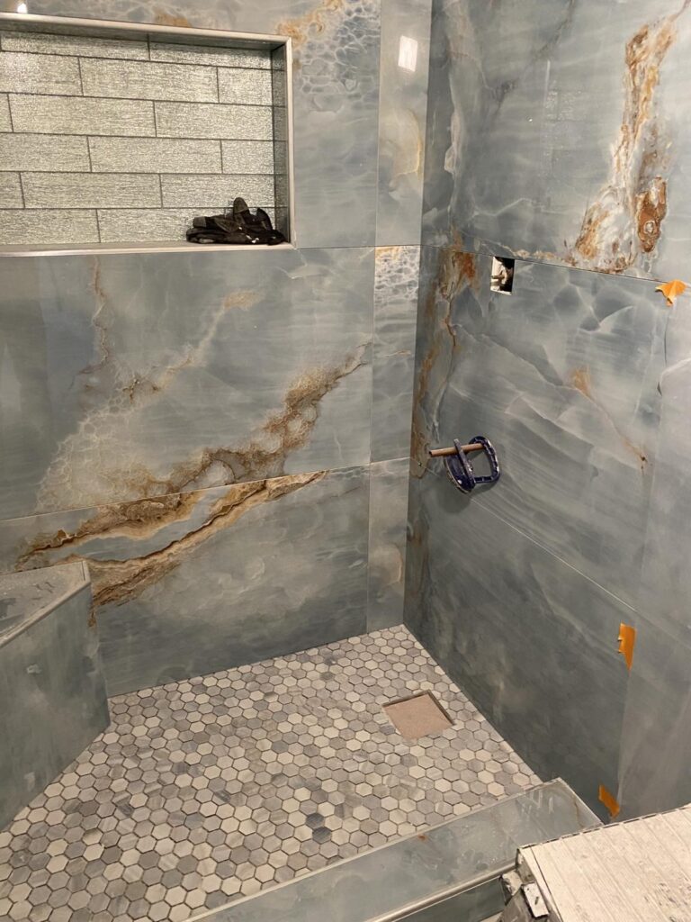Shower tile installation during bathroom remodel