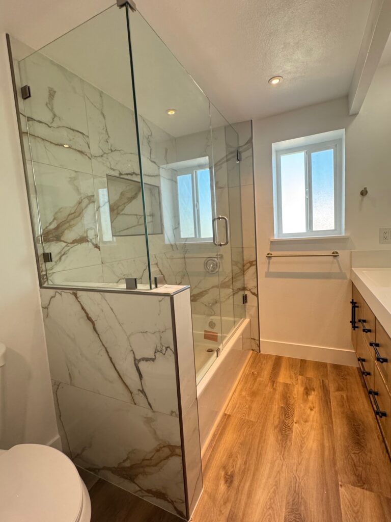 Glass shower with marble-look tile, Anaheim bathroom remodel