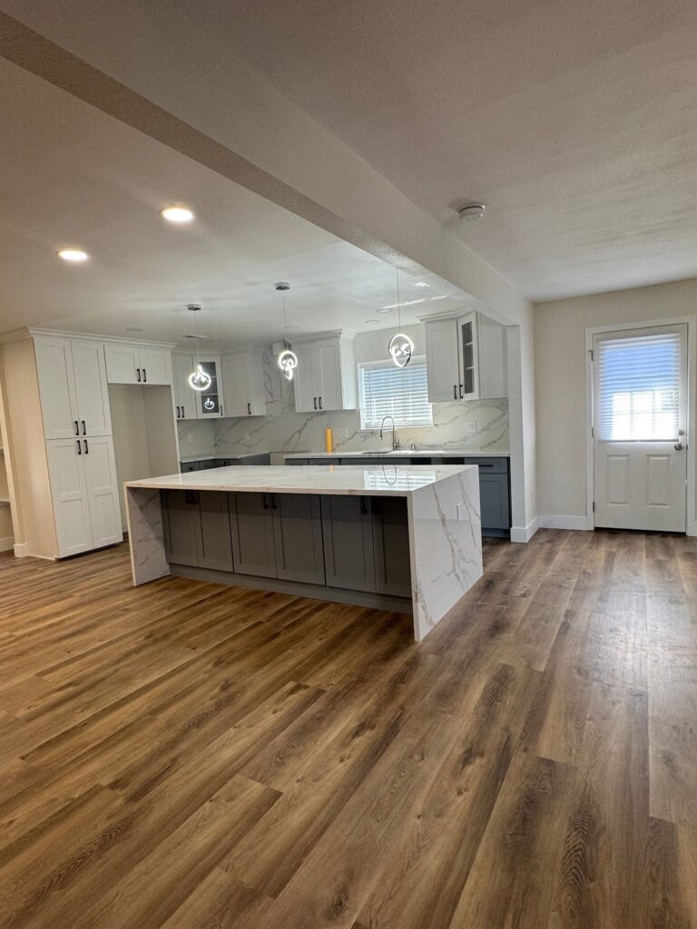 Open kitchen with pendant lights after whole-home remodel, Anaheim, CA